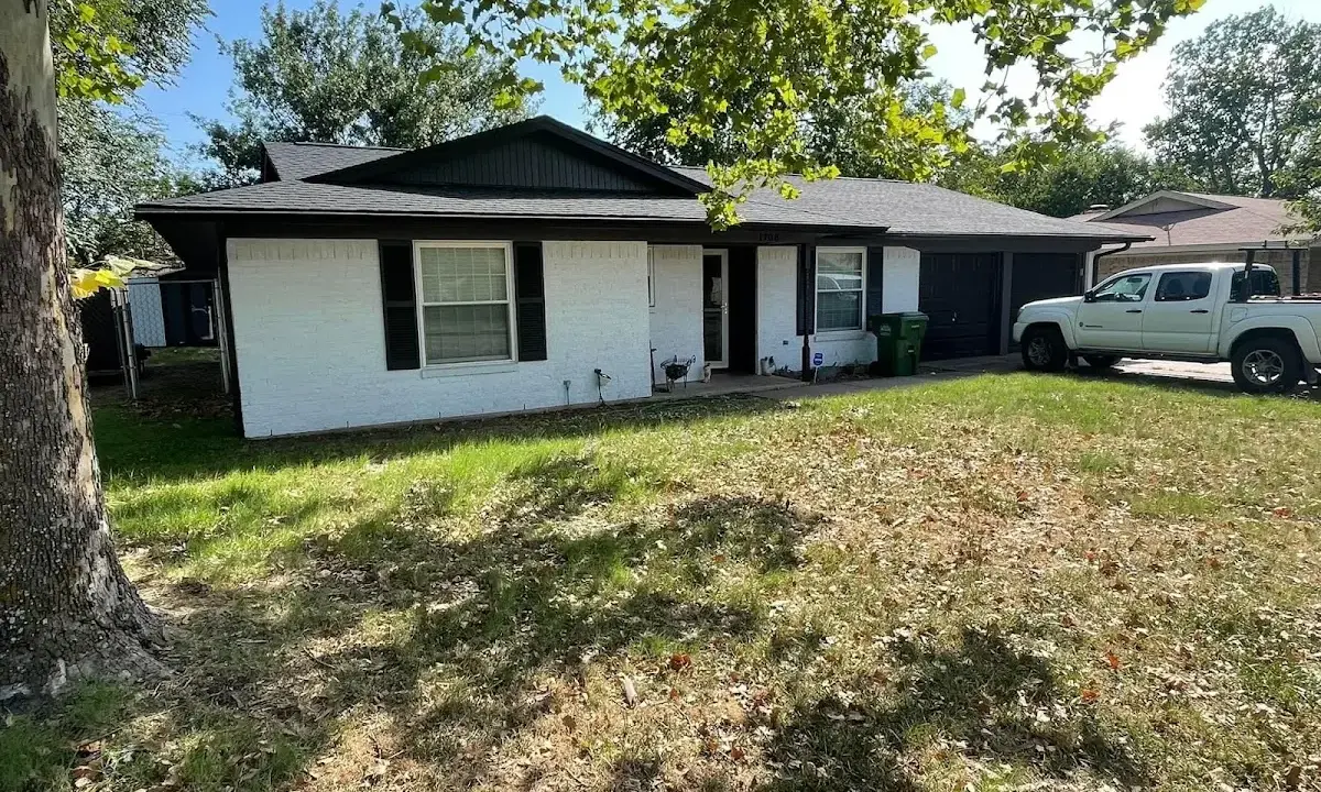 Professional roofing crew working on a residential roof in Clarcona